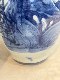 Two Chinese blue and white celadon-ground vases and a blue and white vase, on wooden stands, 19th C.