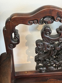 A pair of Chinese carved hongmu armchairs, 19th C.