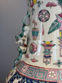 A pair of Chinese famille rose 'Antiquities' vases, 19th C.
