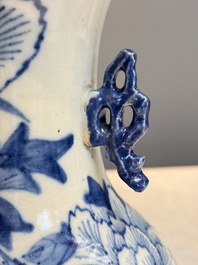 Two Chinese blue and white celadon-ground vases and a blue and white vase, on wooden stands, 19th C.