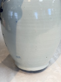 Two Chinese blue and white celadon-ground vases and a blue and white vase, on wooden stands, 19th C.
