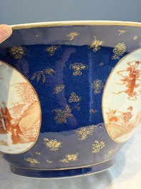 A large Chinese iron-red and gilt-decorated powder-blue-ground bowl with narrative design, 19th C.