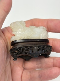 A Chinese carved jade 'Buddhist Lions' group, 19th C.