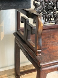 A pair of Chinese carved hongmu armchairs, 19th C.