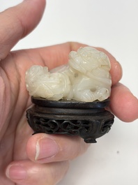 A Chinese carved jade 'Buddhist Lions' group, 19th C.