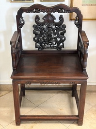 A pair of Chinese carved hongmu armchairs, 19th C.