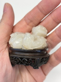 A Chinese carved jade 'Buddhist Lions' group, 19th C.