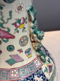 A pair of Chinese famille rose 'Antiquities' vases, 19th C.