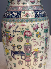A pair of Chinese famille rose 'Antiquities' vases, 19th C.