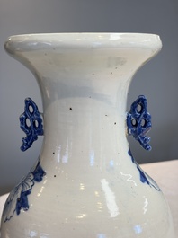Two Chinese blue and white celadon-ground vases and a blue and white vase, on wooden stands, 19th C.