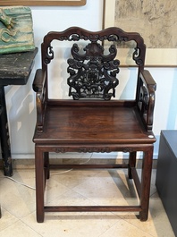 A pair of Chinese carved hongmu armchairs, 19th C.