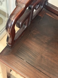 A pair of Chinese carved hongmu armchairs, 19th C.
