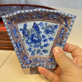 A Chinese enamelled Yixing stoneware nine-piece 'peonies' sweetmeat set on a Southeast Asian lacquer tray, 19th C.