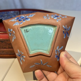 A Chinese enamelled Yixing stoneware nine-piece 'peonies' sweetmeat set on a Southeast Asian lacquer tray, 19th C.