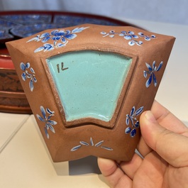A Chinese enamelled Yixing stoneware nine-piece 'peonies' sweetmeat set on a Southeast Asian lacquer tray, 19th C.