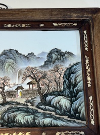 A framed Chinese famille rose 'Mountainous Landscape' plaque, after Wang Yeting 汪野亭, 20th C.