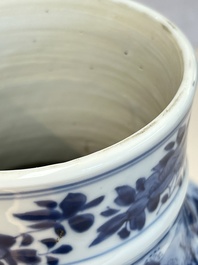 A Chinese blue and white covered vase with figures in landscapes, Kangxi
