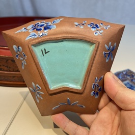 A Chinese enamelled Yixing stoneware nine-piece 'peonies' sweetmeat set on a Southeast Asian lacquer tray, 19th C.