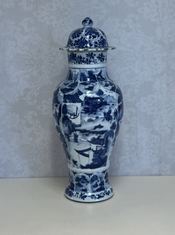 A Chinese blue and white covered vase with figures in landscapes, Kangxi