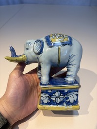 A pair of blue, white and yellow Frankfurt faience models of elephants, ca. 1700