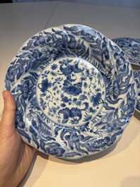 Four Chinese blue and white moulded plates with floral design, Kangxi