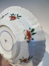 Three sets of Chinese famille verte cups and saucers with birds and flowers, various marks, Kangxi