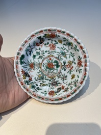 Three sets of Chinese famille verte cups and saucers with birds and flowers, various marks, Kangxi