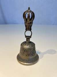 Three Tibetan bronze ritual bells and a bronze Buddha, 19th C.