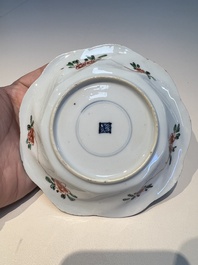 Three sets of Chinese famille verte cups and saucers with birds and flowers, various marks, Kangxi