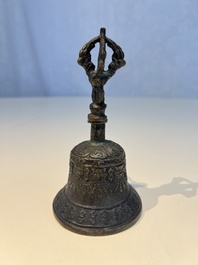Three Tibetan bronze ritual bells and a bronze Buddha, 19th C.