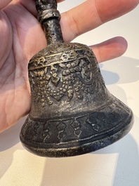 Three Tibetan bronze ritual bells and a bronze Buddha, 19th C.