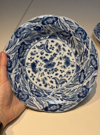 Four Chinese blue and white moulded plates with floral design, Kangxi