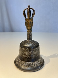 Three Tibetan bronze ritual bells and a bronze Buddha, 19th C.