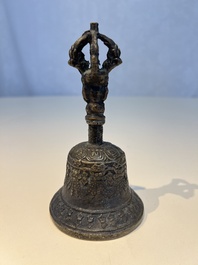 Three Tibetan bronze ritual bells and a bronze Buddha, 19th C.