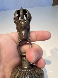 Three Tibetan bronze ritual bells and a bronze Buddha, 19th C.
