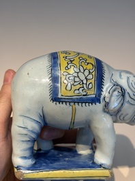 A pair of blue, white and yellow Frankfurt faience models of elephants, ca. 1700