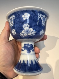 A Chinese blue and white 'Prunus on Cracked Ice' stem bowl, Kangxi