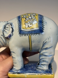 A pair of blue, white and yellow Frankfurt faience models of elephants, ca. 1700