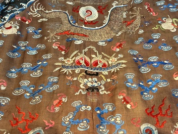 A Chinese brown-ground embroidered silk 'Dragon' robe, 'Ji Fu' 吉服, 19th C.