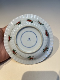 Three sets of Chinese famille verte cups and saucers with birds and flowers, various marks, Kangxi