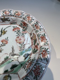 Three sets of Chinese famille verte cups and saucers with birds and flowers, various marks, Kangxi