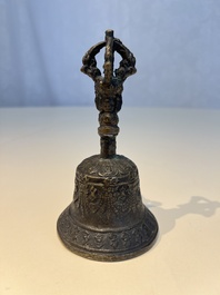 Three Tibetan bronze ritual bells and a bronze Buddha, 19th C.