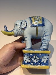 A pair of blue, white and yellow Frankfurt faience models of elephants, ca. 1700
