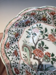 Three sets of Chinese famille verte cups and saucers with birds and flowers, various marks, Kangxi