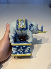 A pair of blue, white and yellow Frankfurt faience models of elephants, ca. 1700
