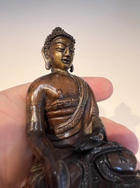 Three Tibetan bronze ritual bells and a bronze Buddha, 19th C.