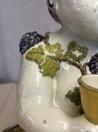 A massive polychrome Brussels faience 'Bacchus on a Barrel' fountain, 18th C.