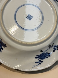 Four Chinese blue and white moulded plates with floral design, Kangxi