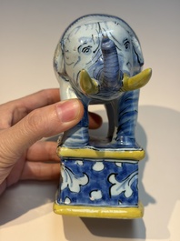 A pair of blue, white and yellow Frankfurt faience models of elephants, ca. 1700