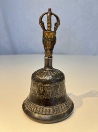 Three Tibetan bronze ritual bells and a bronze Buddha, 19th C.